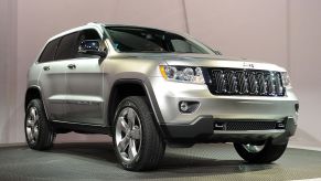 A 2011 Jeep Grand Cherokee on display at an auto show.