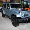 A 2012 Jeep Wrangler on display at an auto show.