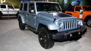 A 2012 Jeep Wrangler on display at an auto show.