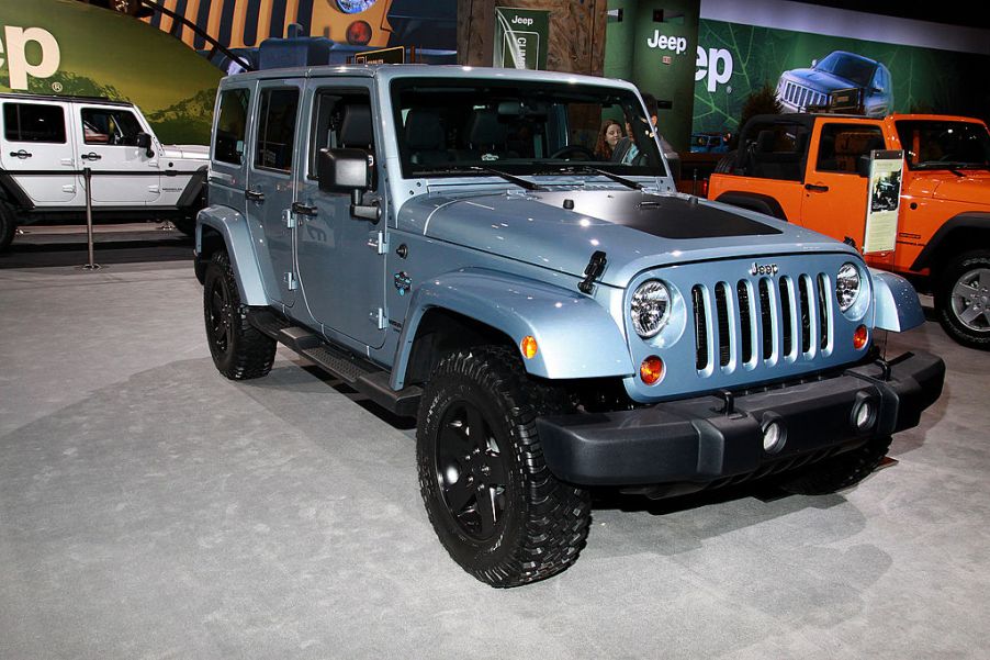 A 2012 Jeep Wrangler on display at an auto show.