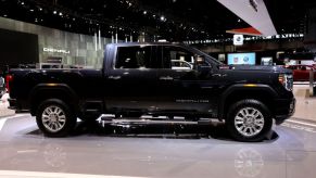 A 2020 GMC Sierra HD on display at an auto show.