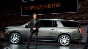 A Chevy employee debuting the new Suburban