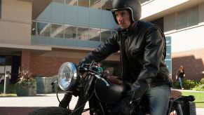 Dax Shepard sitting on a motorcycle ready to ride