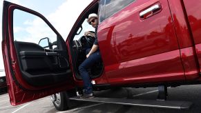 A man climbs out of his Ford F-450