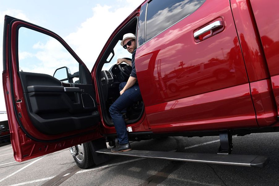 A man climbs out of his Ford F-450