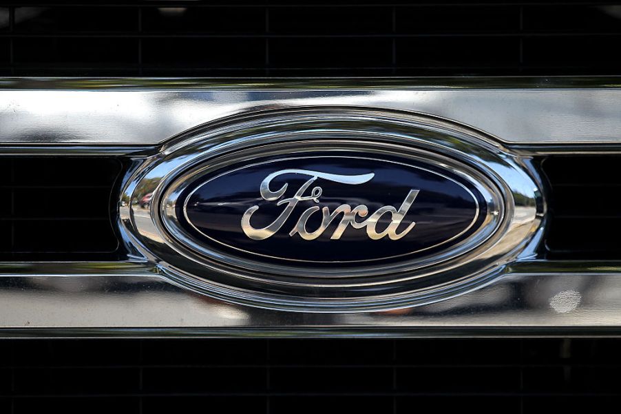 The Ford logo on the front of a pickup truck