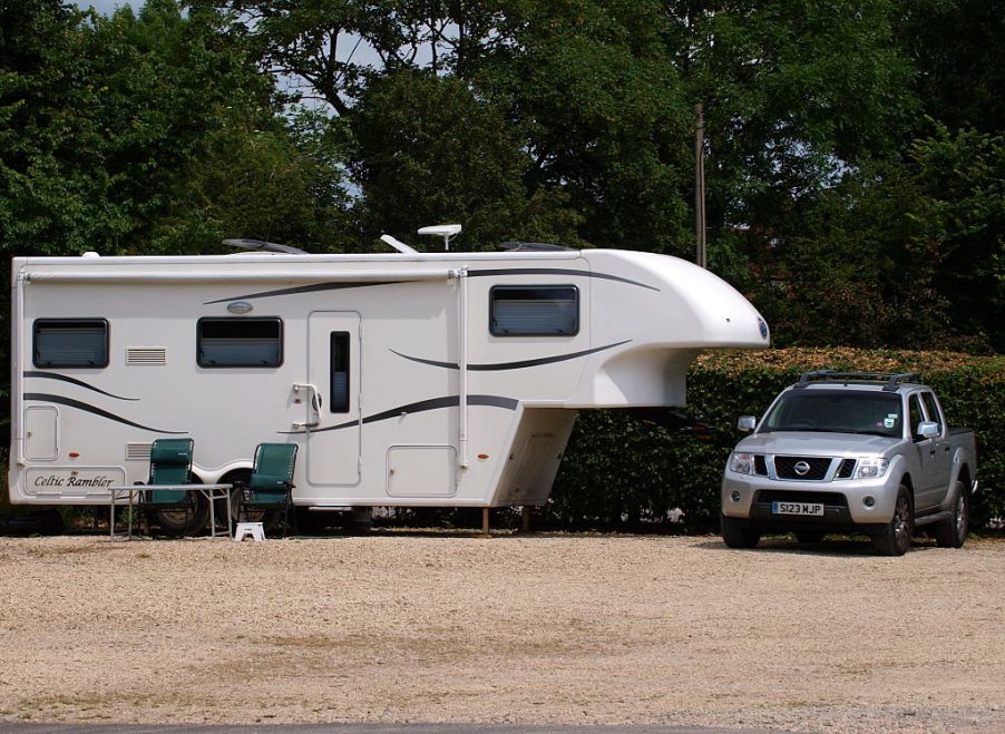 A mid-size Nissan truck getting ready to tow a camper