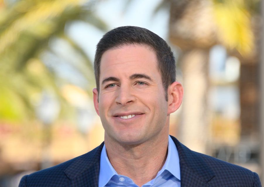 Tarek El Moussa smiles for a press photo