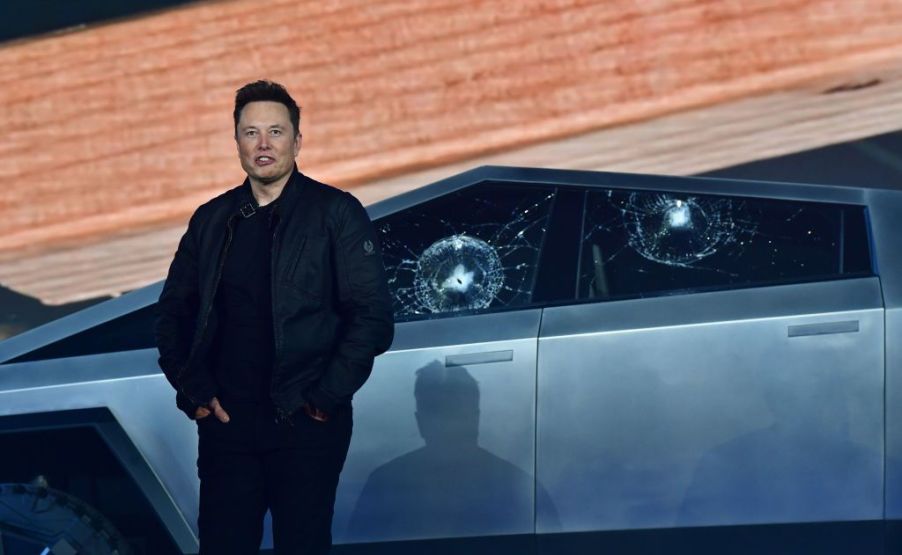 Elon Musk standing in front of a Tesla Cybertruck