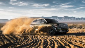 2020 Kia Telluride driving through sand