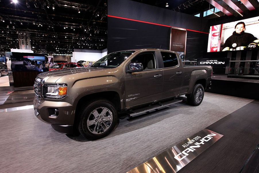 A 2015 GMC Canyon on display at an auto show