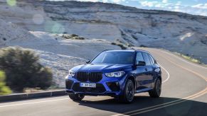 2020 BMW X5 M driving up mountain road