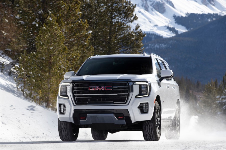 2021 GMC Yukon AT4 driving down icy road