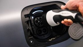 A plug going into an electric car