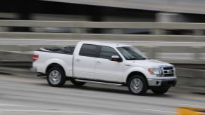 Ford pickup truck drives on a road in Miami