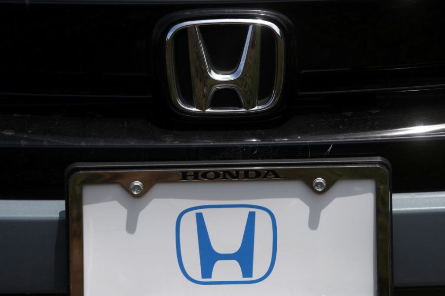 The Honda logo on a new car