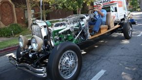 Jay Leno driving an old car