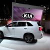 A white Kia Sorento on display during an auto show