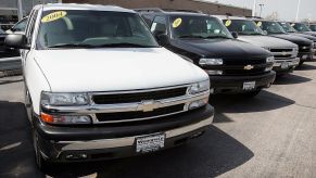 A car dealership offering used Chevy Tahoes