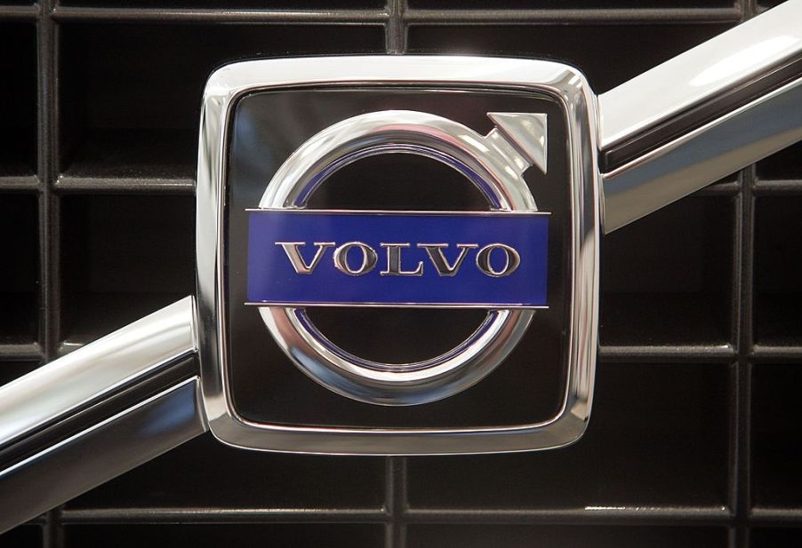 A Volvo logo on the front of a new car