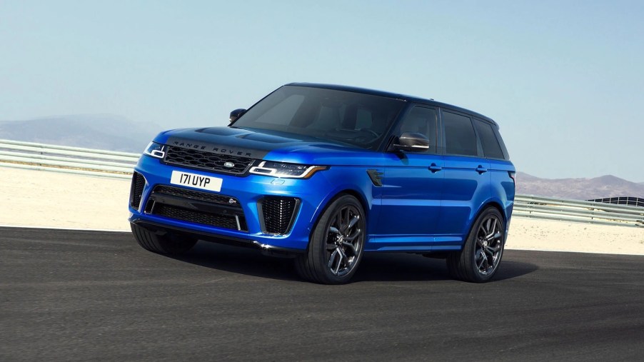 A blue 2020 Land Rover Range Rover Sport SVR speeding down on a dessert highway.