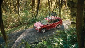 2020 Subaru Forester Limited driving down a gravel road in the woods