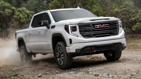 The 2023 GMC Sierra off-roading in dirt