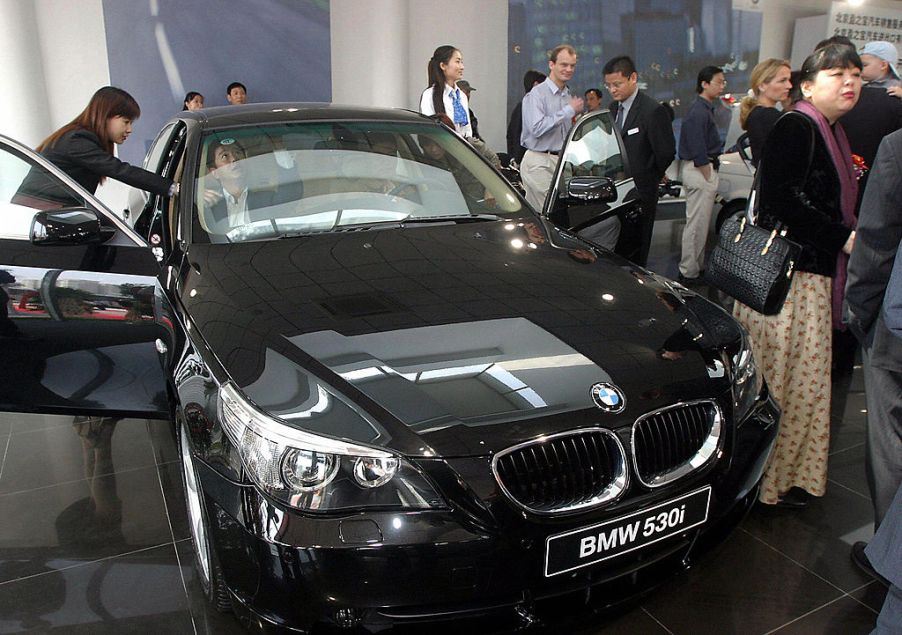 Potential car buyers checking out a BMW car