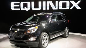 A black Chevy Equinox on display at an auto show