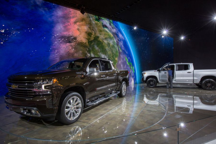 A man looks at a Chevrolet Silverado truck at the auto trade show, AutoMobility LA, at the Los Angeles Convention Center