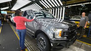 Ford F-150 trucks go through the customer acceptance line at the Ford Dearborn Truck Plant