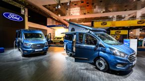 Ford Transit vans on display at an auto show