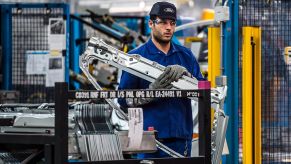 An employee works on Ford Mondeo vehicles on the production line during assembly at Ford plant in Almussafes