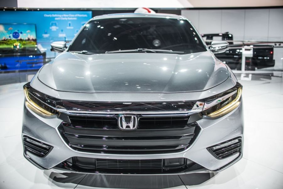 A Honda Insight on display at a car show