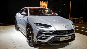 A new Lamborghini Urus on display at an auto show