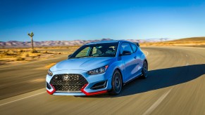 2020 Hyundai Veloster driving down truck