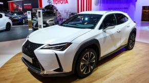 A new Lexus UX SUV on display at an auto show