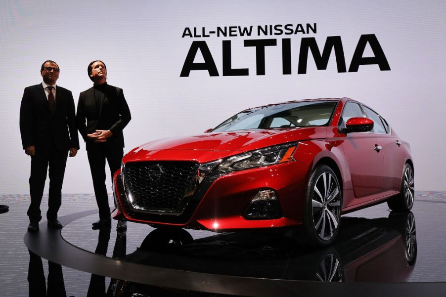 Denis Le Vot (left), the new chairman of Nissan North America and Alfonso Albaisa, senior vice president, Global Design, stand beside the 2019 Nissan Altima sedan at the New York International Auto Show