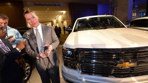 Chief Engineer of GM's full and mid-size trucks, Jeff Luke(C) accepts the North American Car and Truck of the year award for the Silverado truck, January 13, 2014 at the 2014 Detroit Auto Show