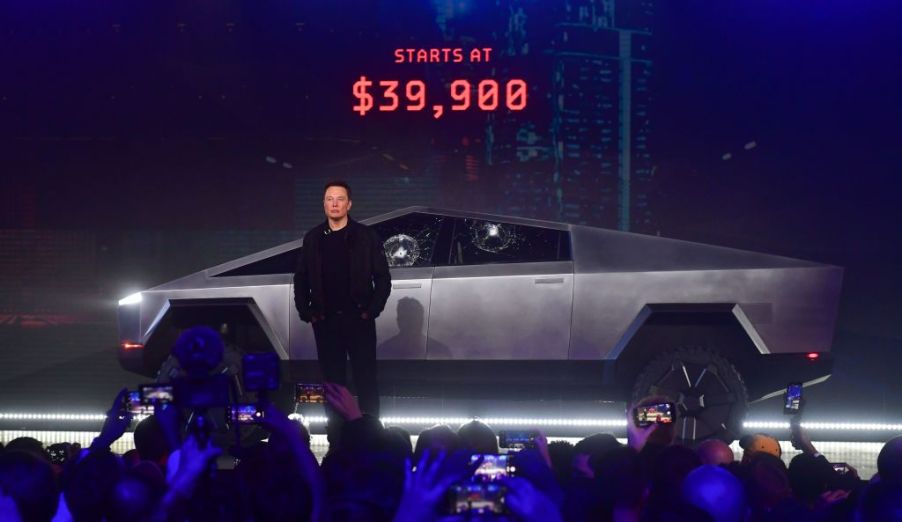 Elon Musk standing in front of the Tesla Cybertruck during its debut