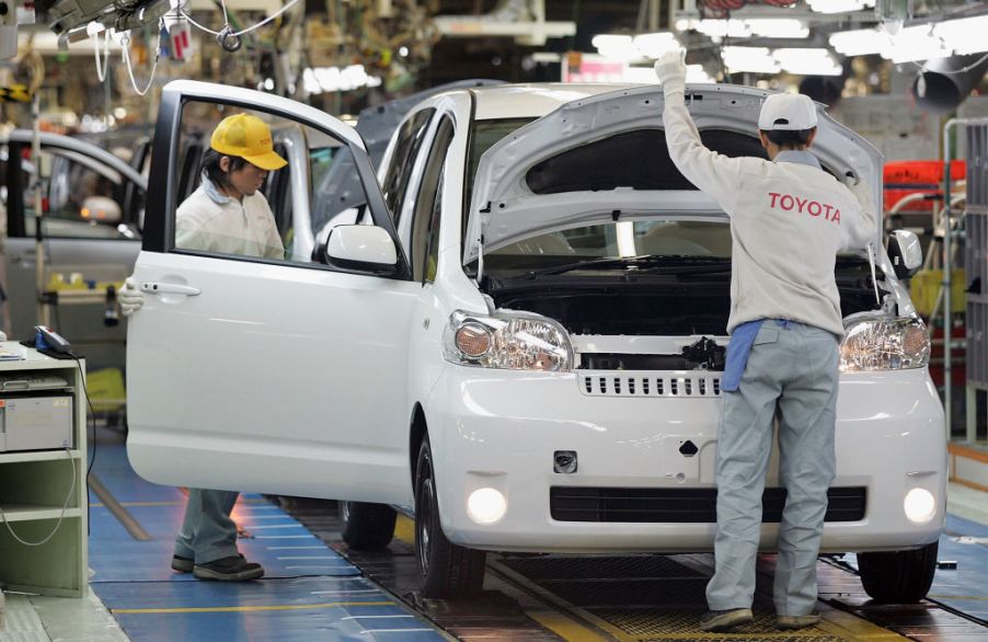 Toyota employees working on an assembly line