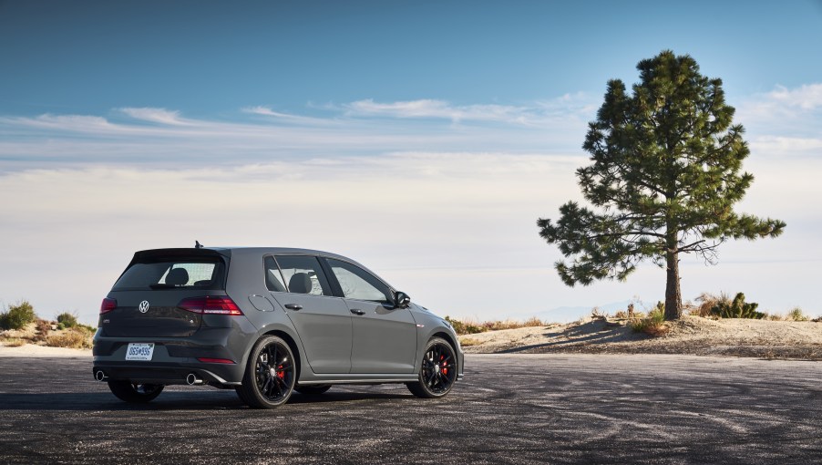 A sea-foam green Rabbit Edition GTI parked on a countryside.