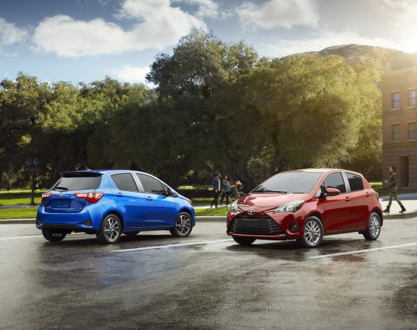 Two Yaris hatchbacks side by side.