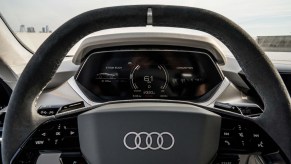 A black matte Audi e-tron steering wheel.