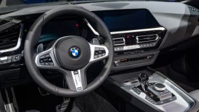 An interior view of the driver's side of a BMW Z4 Roadster on display at a car show