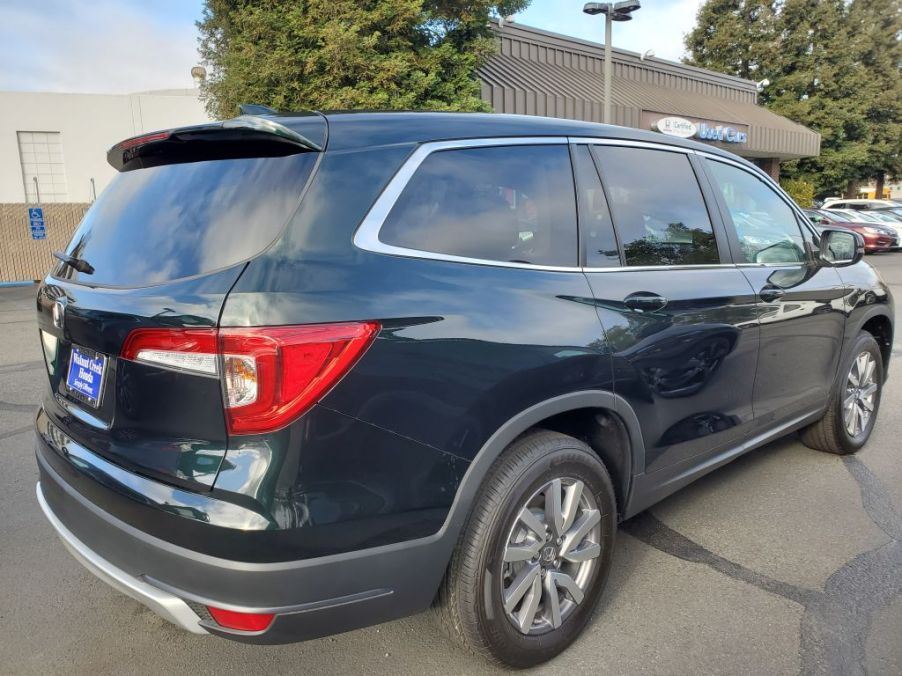 A new Honda Pilot parked in a driveway