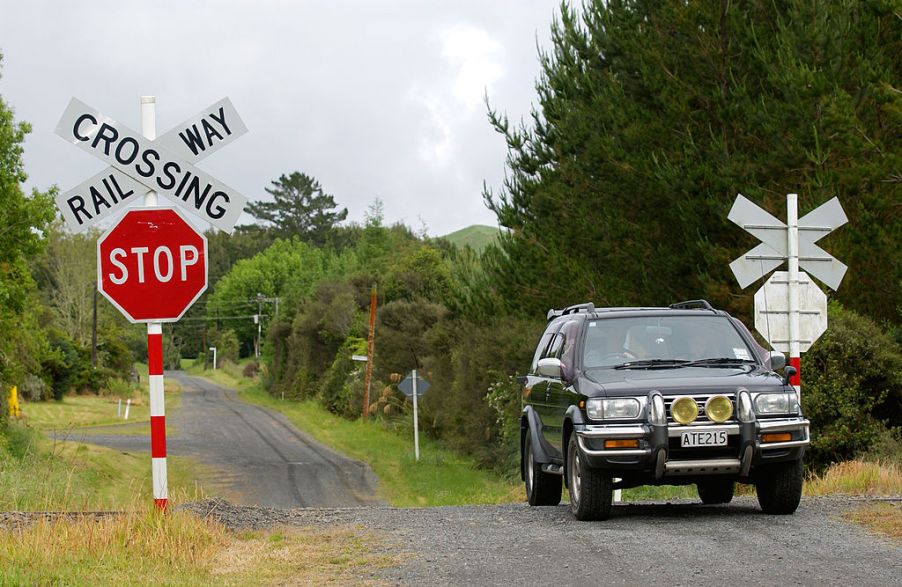 A driver pulling up to a traffic sign