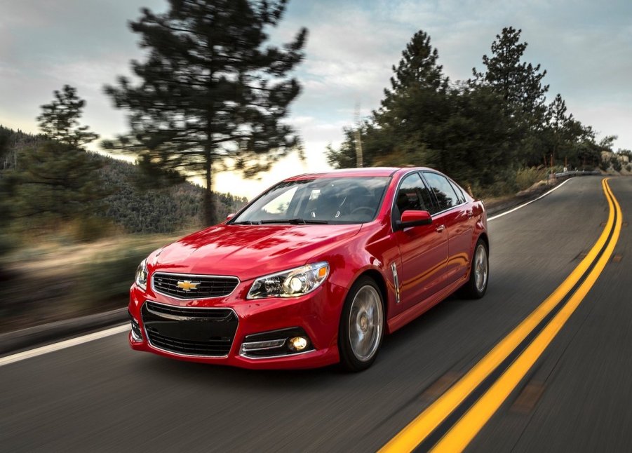 2014 Chevrolet SS in red driving down a road