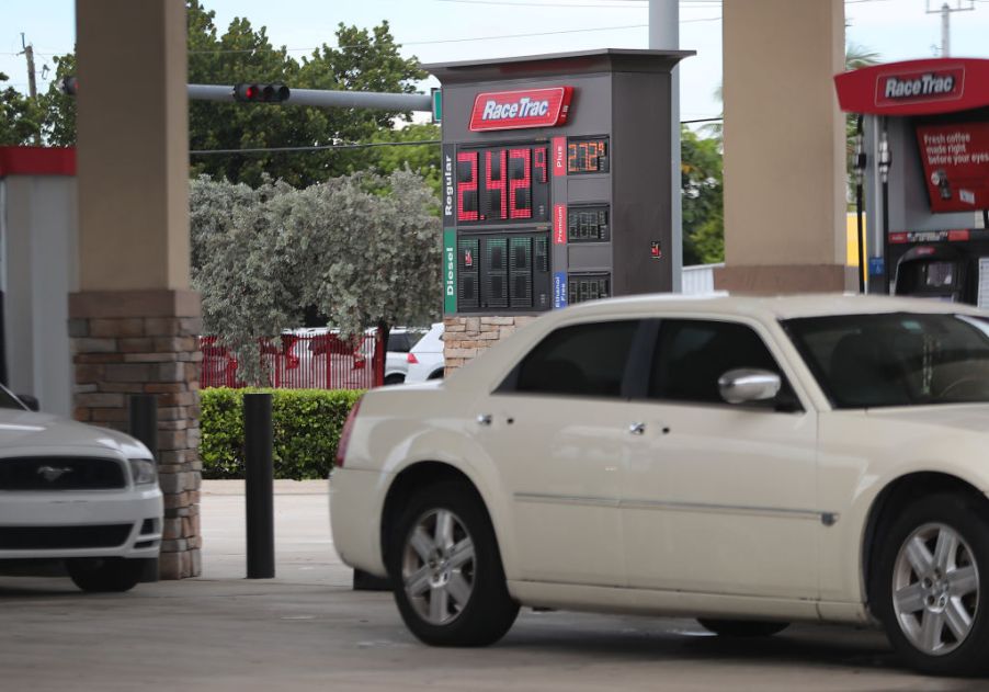 A sign indicates that the price per gallon of regular gas is $2.42 at a gas station on June 13, 2019 in Miami, Florida