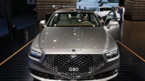 A Genesis G90 on display at an auto show